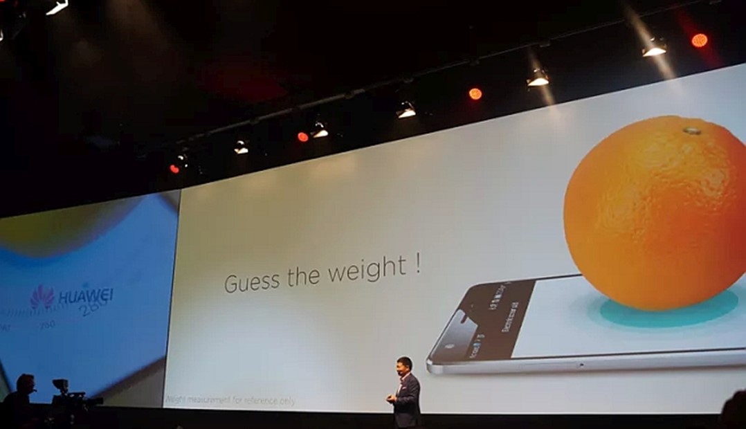 Huawei Mate S weighing orange