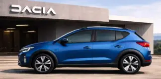 Blue SUV parked in front of a dealership with a concrete façade and the word DACIA visible above the entrance.