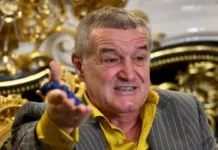 Gigi Becali a CLACAT În Direct după Rușinea FCSB cu Auda (VIDEO) Man in a pinstripe suit and yellow shirt gesturing as he speaks in a lavish, gold-adorned room.