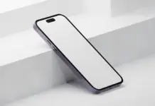 iPhone 2027 Aproape de Productie de Test la Partenerii Apple Product render of a slim white smartphone with black border and purple edge, resting diagonally on a pale stepped surface.