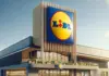 Ofertele LIDL Romania cu Promotii Speciale Pentru Milioane de Romani Lidl supermarket exterior with a tall sign displaying the blue and yellow Lidl logo against a clear sky