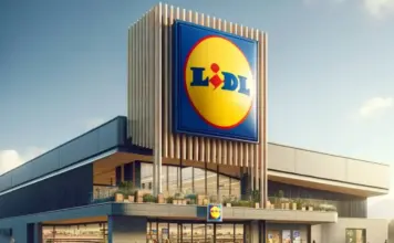 Ofertele LIDL Romania cu Promotii Speciale Pentru Milioane de Romani Lidl supermarket exterior with a tall sign displaying the blue and yellow Lidl logo against a clear sky