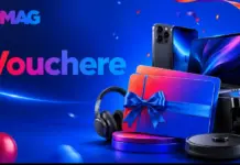 Blue promotional banner with gadgets (laptop, headphones) and a gift box with blue ribbon, suggesting vouchers and prizes from eMAG.