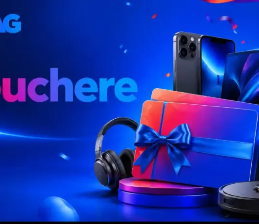 Blue promotional banner with gadgets (laptop, headphones) and a gift box with blue ribbon, suggesting vouchers and prizes from eMAG.