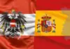 Overlap of Austria flag (red-white-red with black eagle) and Spain flag (yellow with coat of arms) on a single banner.
