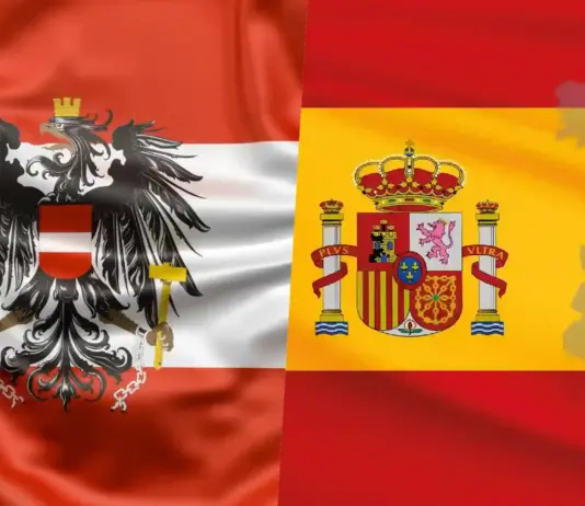 Overlap of Austria flag (red-white-red with black eagle) and Spain flag (yellow with coat of arms) on a single banner.