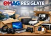 Open boxes filled with assorted electronics and appliances, including a laptop, monitor, camera, headphones, game controller, and kitchen devices in a warehouse setting.