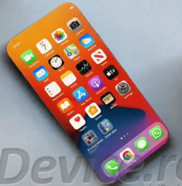 iPhone 20 Pro: Schimbarile Complet Neasteptate Dezvaluite Close-up of a smartphone displaying a colorful home screen with many app icons on a light desk surface, angled from above.